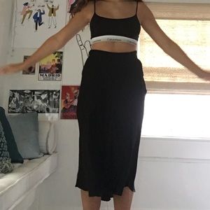 below the knee black skirt